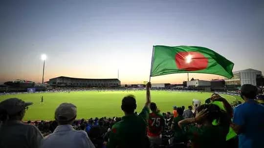 Afan waving the Bangladesh flag at cricket match