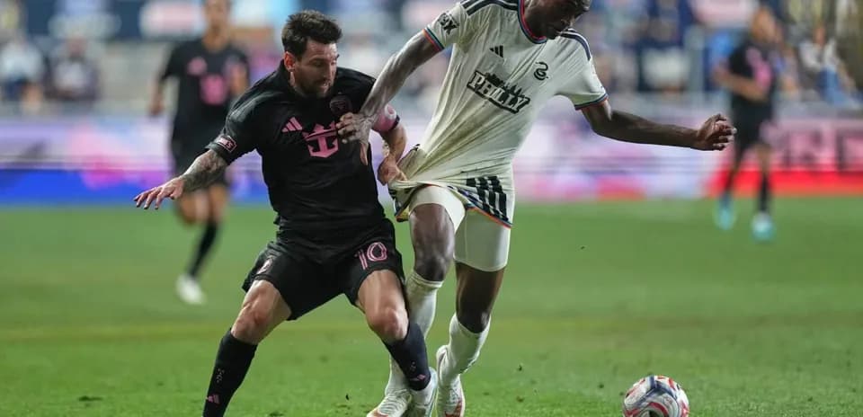 Lionel Messi tackling a Philadelphia Union player