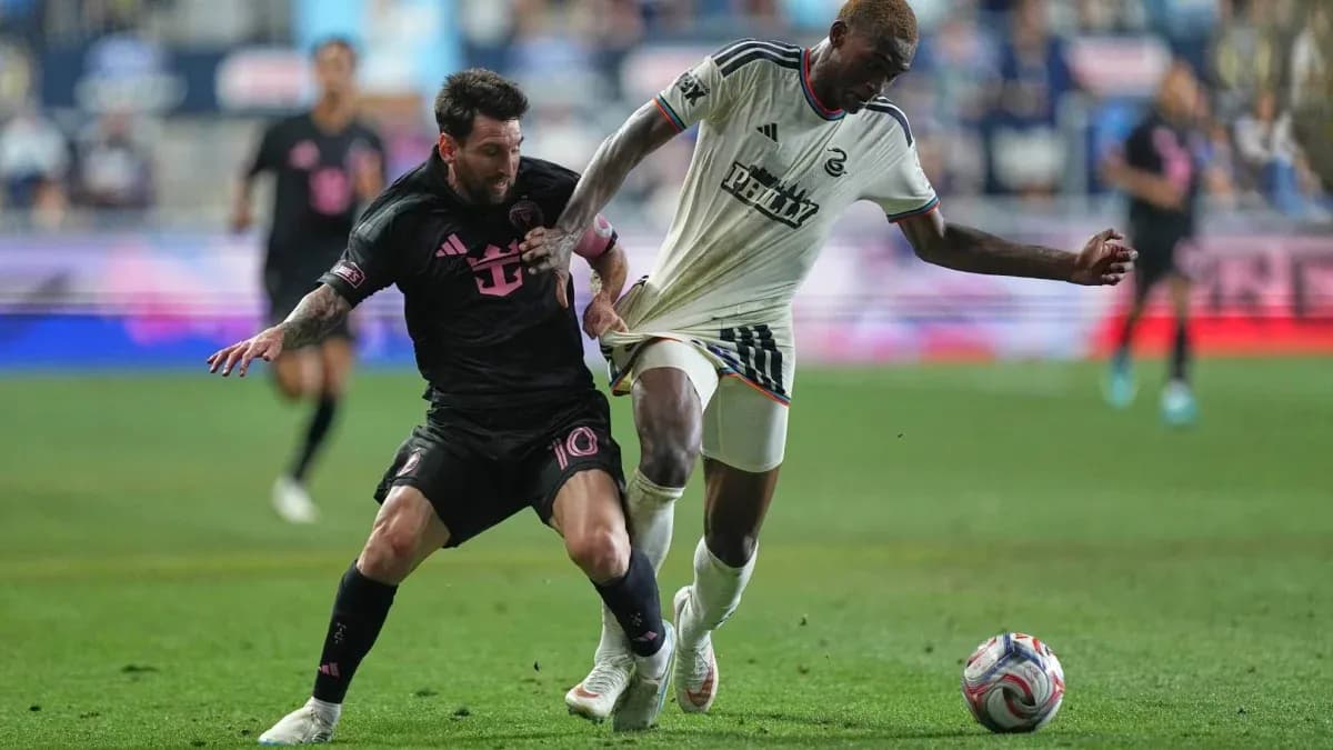 Lionel Messi tackling a Philadelphia Union player