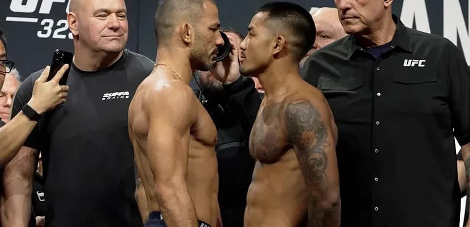 Luchadores en pesaje cara a cara antes de combate