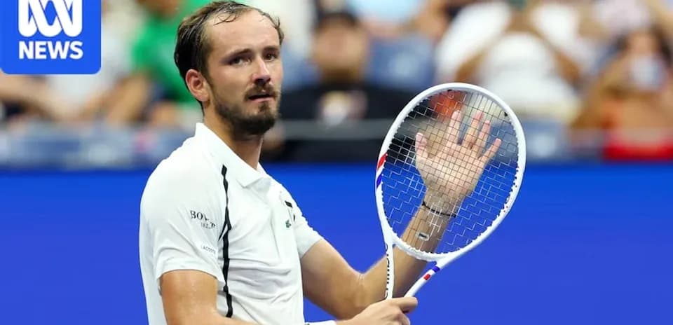 Daniil Medvedev gesturing during a tennis match