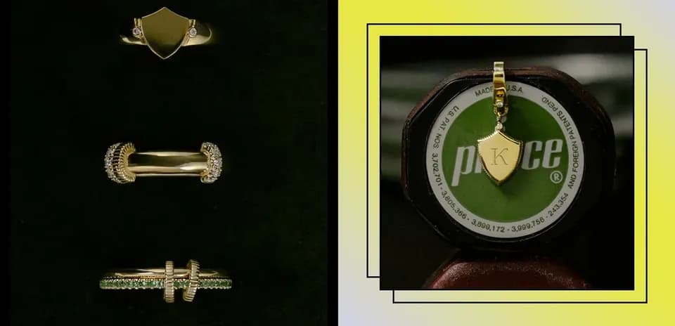 Conjunto de anillos y colgante dorado sobre fondo oscuro