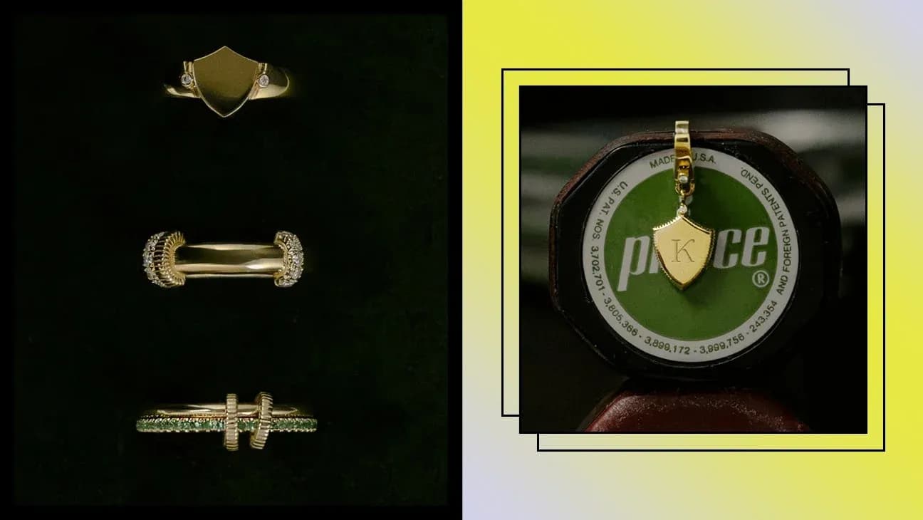 Conjunto de anillos y colgante dorado sobre fondo oscuro