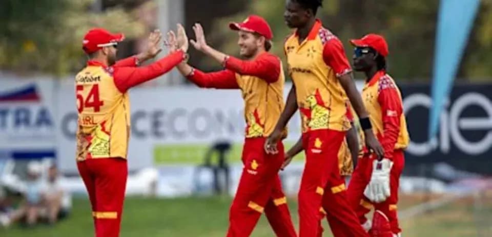 Jugadores celebrando un wicket en el cricket