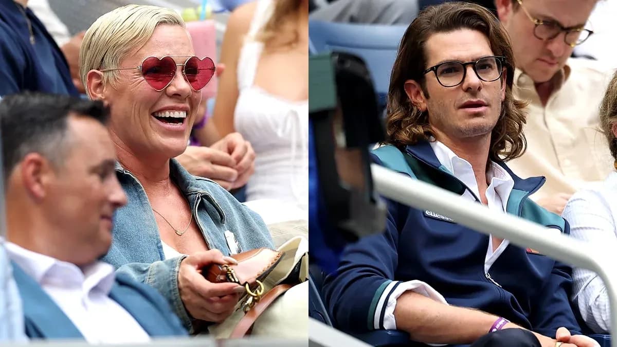 Espectadores en un evento deportivo, uno sonriendo Espectadores en un evento deportivo, uno sonriendo