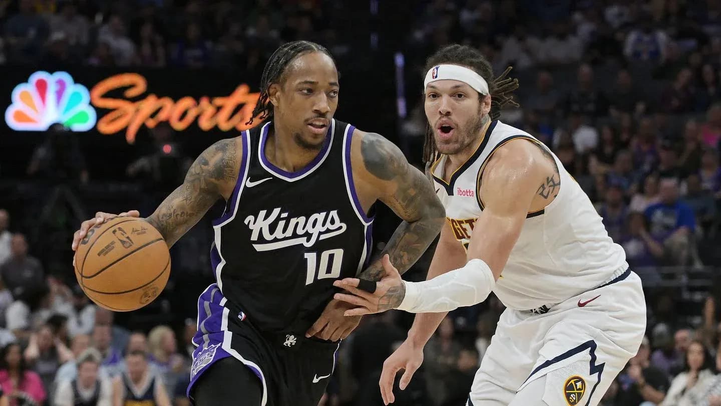 Jugador de Kings driblando ante defensor de Nuggets Jugador de Kings driblando ante defensor de Nuggets