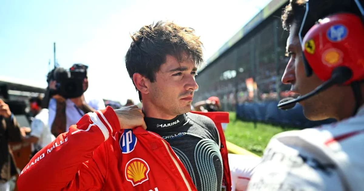 Piloto ajustándose la chaqueta en el circuito Piloto ajustándose la chaqueta en el circuito