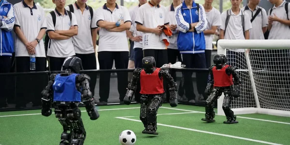 Robots playing soccer on a mini field Robots playing soccer on a mini field